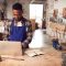 Male Craftsman In Carpentry Workshop For Bamboo Bicycles  Doing Accounts On Laptop